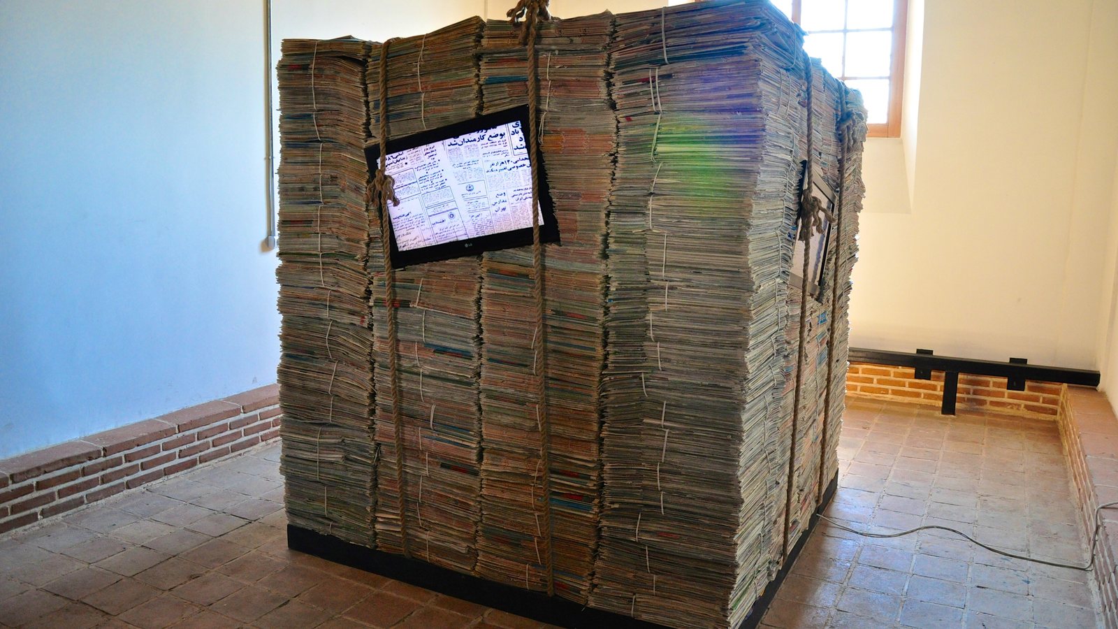A stack of folded newspapers