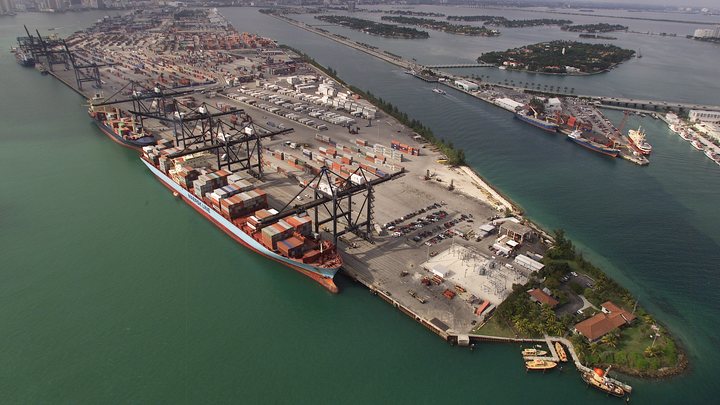 Aerial view of the PortMiami container terminal with a Maersk container ship moored under gantry cranes