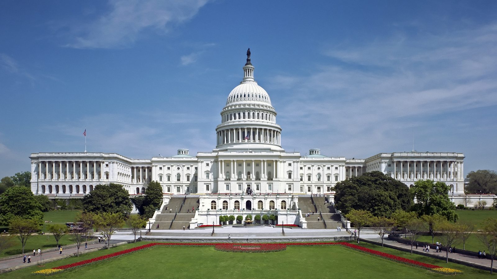 The west front of the United States Capitol in Washington under a blue sky